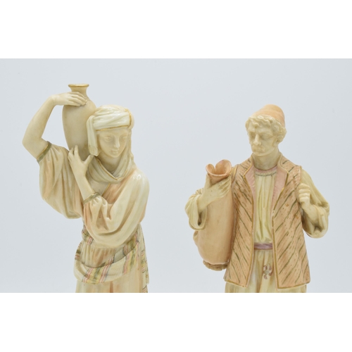 43A - A pair of Royal Worcester blushed ivory male and female water carriers, '1206' impressed to base', d... 