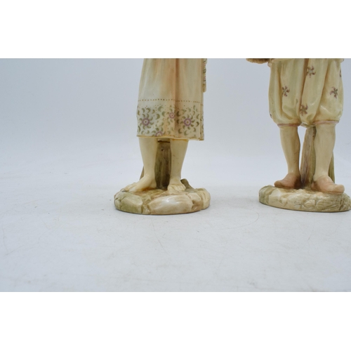 43A - A pair of Royal Worcester blushed ivory male and female water carriers, '1206' impressed to base', d... 