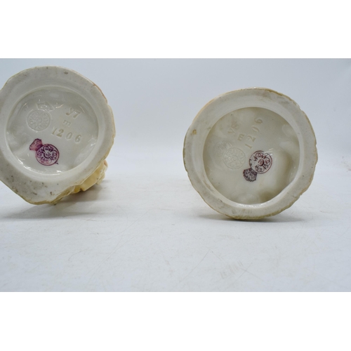 43A - A pair of Royal Worcester blushed ivory male and female water carriers, '1206' impressed to base', d... 