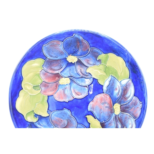 102E - Large Moorcroft Hibiscus on blue charger / gateau plate, 31cm diameter.