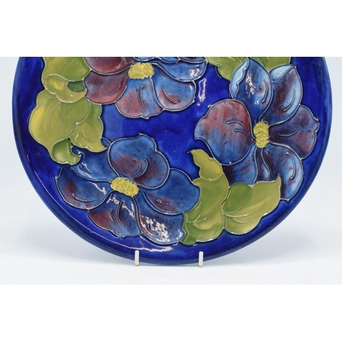 102E - Large Moorcroft Hibiscus on blue charger / gateau plate, 31cm diameter.