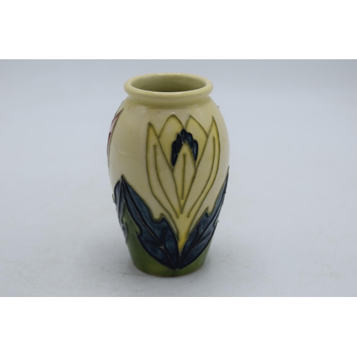 102K - Moorcroft vase on cream background with floral design, 10.5cm tall.