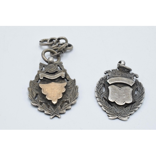 180H - A pair of hallmarked silver fobs, 23.4 grams.