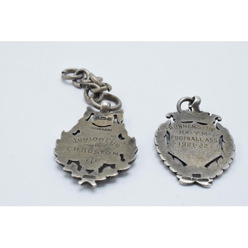 180H - A pair of hallmarked silver fobs, 23.4 grams.