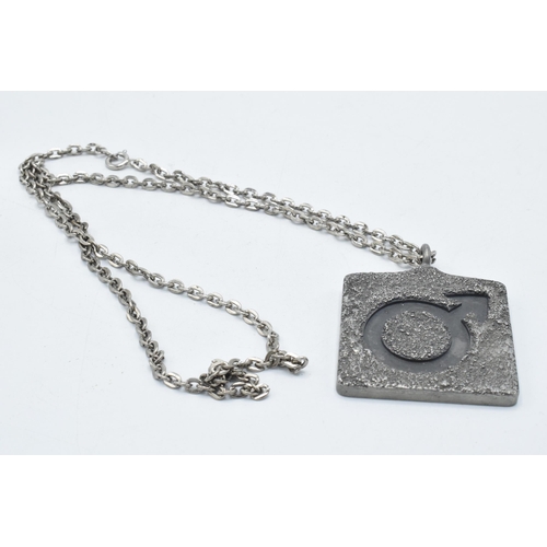 180I - Jorgen Jensen pewter pendant, marked 'Jorgen Jensen Denmark 299' on white metal chain, 4.5cm diamete... 