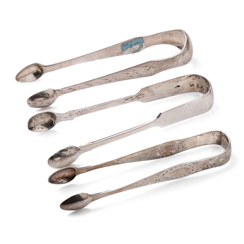 100 - A trio of Georgian sugar tongs, with varying designs to include a floral scene, 131.0 grams.