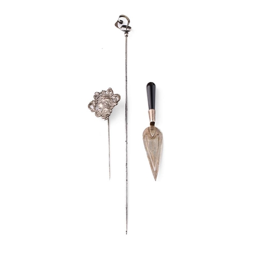 117 - A trio of silver items to include a Charles Horner stick pin, a maiden stick pin and a miniature cak... 