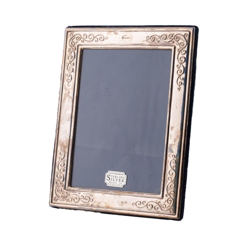 121 - Hallmarked silver easel-backed photo frame, 22cmx18cm, Sheffield 1993.