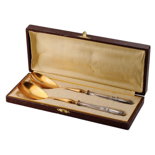 123 - A cased pair of late 19th century silver and gilt metal salad servers, probably European, with indis... 