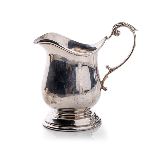 148 - Silver cream jug on pedestal base, Sheffield 1943, 115.3 grams, 10cm tall.