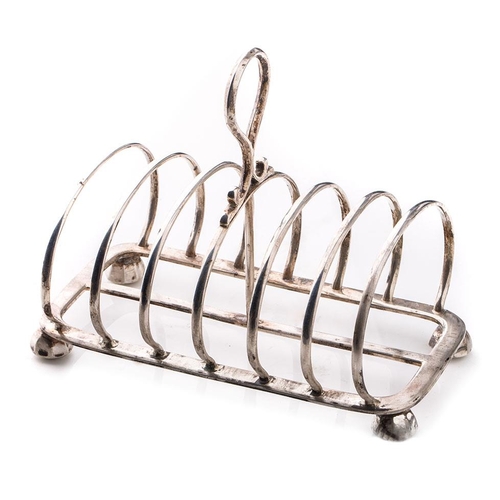 152 - Victorian silver arched 6-space toast rack, Edinburgh 1877, 318.4 grams, 17cm long.