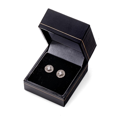 282 - 9ct gold (tests as or better) white gold pair of diamond set earrings with 9ct gold backs, 2.7 grams... 