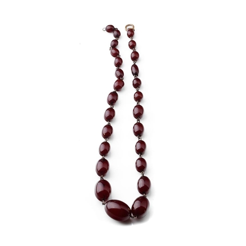 337 - A set of graduated cherry amber (or similar) beads with metal mounts, gross weight 25.4 grams, 43cm ... 