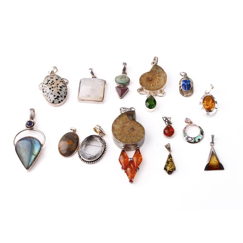 383 - An interesting collection of silver pendants with various gemstones and similar materials of varying... 