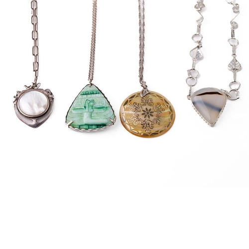 402 - A collection of silver necklaces with large pendants made from various materials (4).