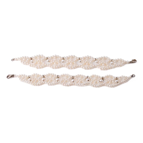 408 - A pair of silver mounted pearl bracelets, 19.5cm long (2).