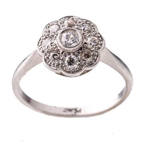 444 - Platinum and diamond daisy ring with 0.4ct of diamonds, size P/Q, 4.9 grams.