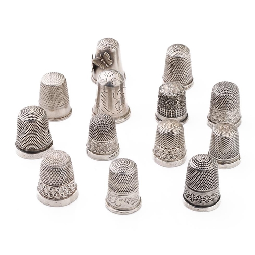 70 - A collection of silver thimbles to include a set of three with etched star, by Henry Griffiths and S... 