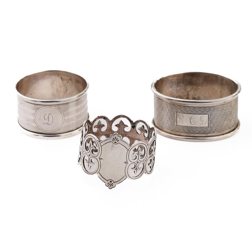 76 - A trio of silver napkin rings to include Birmingham 1917, Emile Viner of Sheffield, and Birmingham 1... 