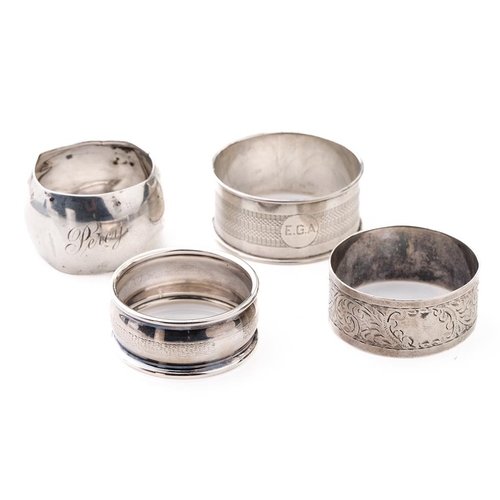 77 - A collection of silver napkin rings to include Chester 1920, Thomas Bradbury & Sons Sheffield 1916, ... 