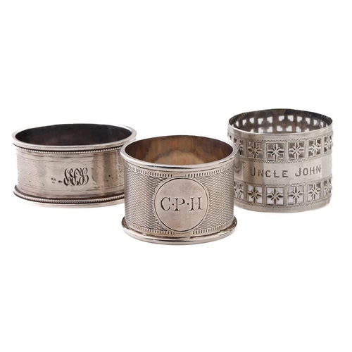 79 - A trio of silver napkin rings of varying designs to include Martin, Hall & Co Sheffield 1881, Colin ... 