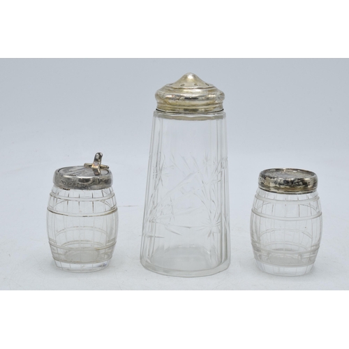 102 - Silver topped sugar sifter, London 1914, together with a pair of barrel-shaped cruets, Birmingham 18... 