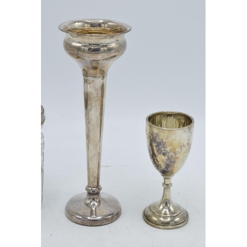 103 - A trio of silver items to include small chalice, Birmingham 1931, 28.6 grams, a loaded silver vase, ... 