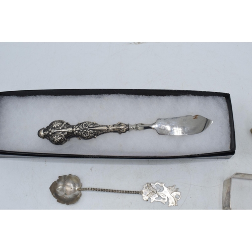 105 - A collection of silver items to include a pair of silver and Mother of Pearl handled fish knives, Bi... 