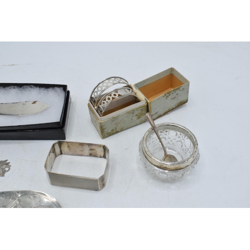 105 - A collection of silver items to include a pair of silver and Mother of Pearl handled fish knives, Bi... 