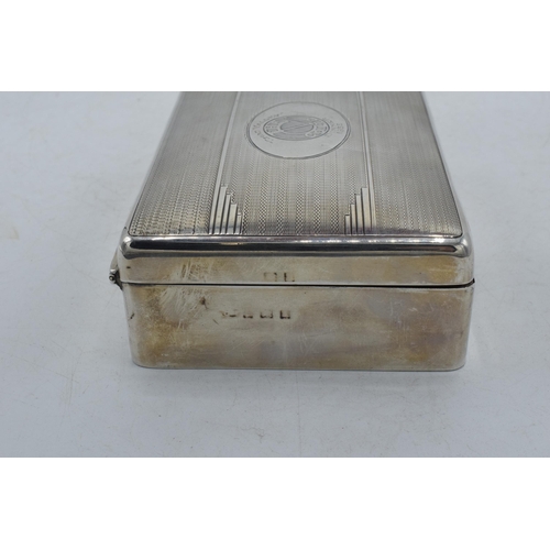 106 - Silver cigarette box with engineered decoration and crest 'The Chad Valley Co Ltd Dinner 1933', 12.5... 