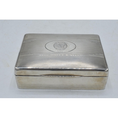 106 - Silver cigarette box with engineered decoration and crest 'The Chad Valley Co Ltd Dinner 1933', 12.5... 