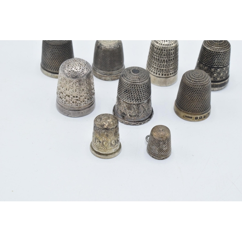 112 - A collection of silver thimbles to include examples by Charles Horner and others (9), 37.4 grams.