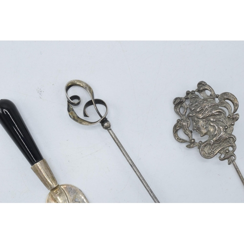 117 - A trio of silver items to include a Charles Horner stick pin, a maiden stick pin and a miniature cak... 