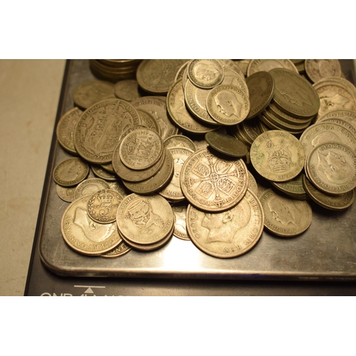 12 - A large collection of 1920-1946 silver coinage of varying denominations, approx 1040+ grams.