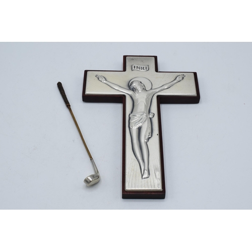 130 - A silver fronted INRI crucifix scene of Jesus on his cross together a novelty golf club with silver ... 