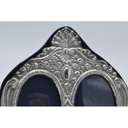 133 - Hallmarked silver fronted double photo frame, 18cm wide, Birmingham 1995.