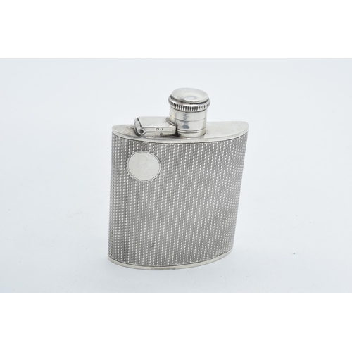 134 - Hallmarked silver hip flask with engineered decoration and vacant cartouche, 78.7 grams, 'Cambridge ... 