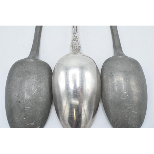 140 - A pair of antique pewter serving spoons together with a silver plated example (3).