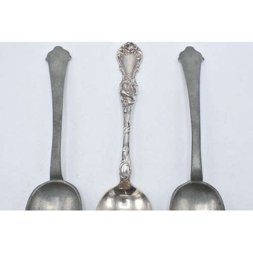 140 - A pair of antique pewter serving spoons together with a silver plated example (3).