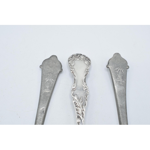 140 - A pair of antique pewter serving spoons together with a silver plated example (3).