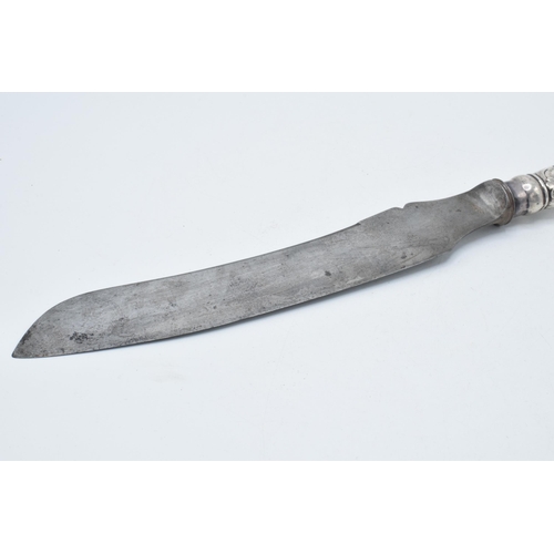 141 - Large silver handled carving knife, 34cm long hallmarks rubbed.