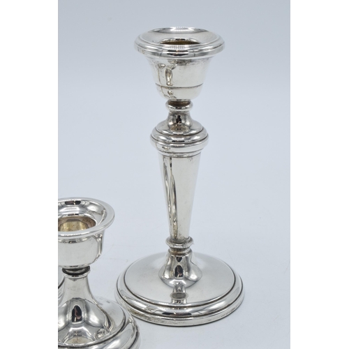 156 - A near pair of hallmarked silver candlesticks, made by W I Broadway & Co, Birmingham 1984 and 1989, ... 