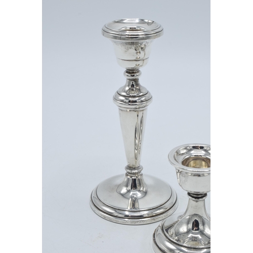 156 - A near pair of hallmarked silver candlesticks, made by W I Broadway & Co, Birmingham 1984 and 1989, ... 