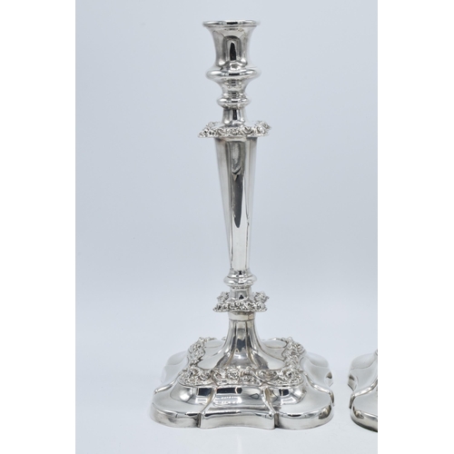 157 - A pair of silver plated large candlesticks with embossed floral decoration, 31.5cm tall (2).