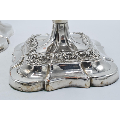 157 - A pair of silver plated large candlesticks with embossed floral decoration, 31.5cm tall (2).