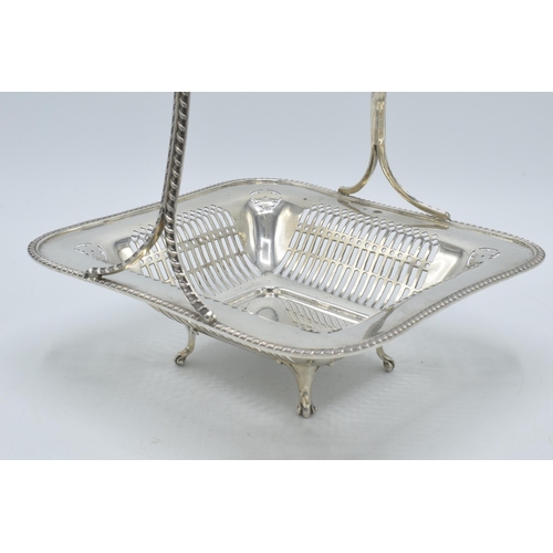 158 - Silver basket with ornate handle and pierced decoration, London 1925, Goldsmiths & Silversmiths, 442... 