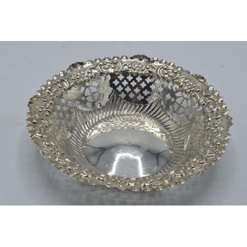 161 - Silver sweet dish with repousse and pierced decoration, 36.4 grams, Chester 1897, 12cm diameter.