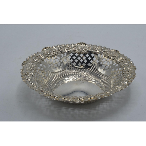 161 - Silver sweet dish with repousse and pierced decoration, 36.4 grams, Chester 1897, 12cm diameter.