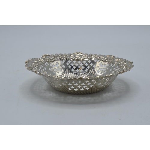 161 - Silver sweet dish with repousse and pierced decoration, 36.4 grams, Chester 1897, 12cm diameter.