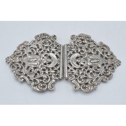 165 - Silver ornate belt buckle with figural design, London 1985, 75.8 grams, 12cm wide.